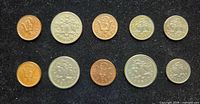 Obverse sides of 10 Barbados coins laid out on black background
