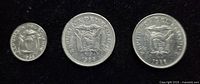 Obverse of three Ecuadorian coins showing national coat of arms and years 1968, 1986, 1988