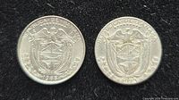 Reverse of both coins showing coat of arms and dates 1966, 1973
