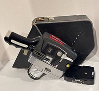 Camera, case, and battery pack grouped together