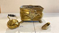 Front view of jardiniere, kettle and shoe showing overall design and size relation