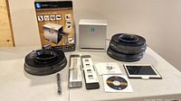 All items laid out including converter, box, three carousels, trays, backlight panel, CD, manual, brush