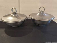 Both covered bowls with lids, front view