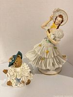 Both figurines front view showing scale and detailing