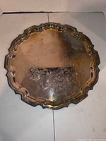 Top view of entire round tray showing engraving and rim detail