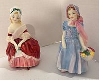Front view of both figurines showing colours and poses