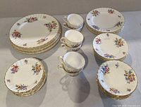 Overhead view showing full assortment of plates, saucers, bowls and cups
