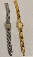 Both wrist watches side-by-side showing overall condition and bracelet styles