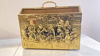Front view showing brass tavern scene and handle