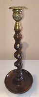 Full view of candlestick showing wood spiral column and brass cup/drip pan