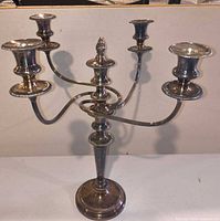 Front view showing full candelabra structure and silver finish