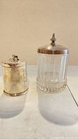Both lidded jars side by side showing relative sizes and designs