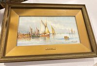 Full view of framed watercolor showing boats on water