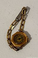 Full view of octagonal wristwatch with link bracelet