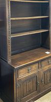 midsection showing open shelves and lower drawers/doors