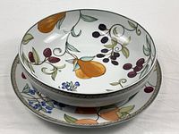 Serving bowl nested on platter showing overall pattern