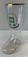 Front view showing DAB logo and gold rim on glass beer boot