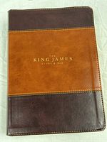 Front cover showing leather binding and gold title