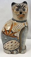 Full front view of large burnished Tonalá ceramic cat figurine