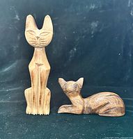 Front view of both cat figurines
