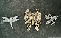 Front view of all three brooches
