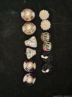 Group view of all seven pairs of clip-on earrings