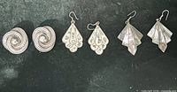all three pairs of sterling silver earrings displayed side by side