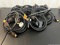 Coiled black HDMI cables with gold-plated connectors