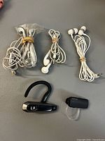Five earpieces: two mono Bluetooth headsets, three sets wired earbuds