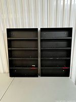 Front view of both Laserline AC100 racks showing overall design and condition