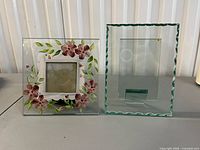 Front view of both glass photo frames showing designs and condition