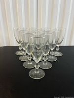 Front angled view of all 10 Libbey Georgian champagne glasses
