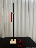 Skirt hem marker assembled showing rod, chalk holder, bulb, hose and ceramic base