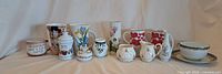 Full group view of all twelve china pieces aligned