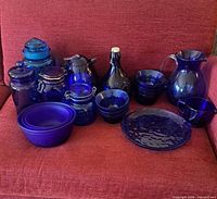 Entire assortment of blue glassware on chair