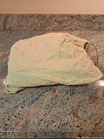 Cloth drawstring bag folded on countertop