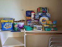 Overall view of mixed cleaning and household supplies on shelves