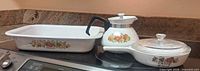 Three Spice of Life pieces: rectangular baker, teapot, skillet with lid