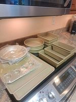 Overall view of Goldtouch bakeware pieces on countertop and stove
