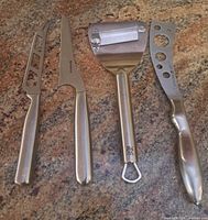 Group shot of all four stainless cheese tools