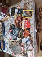 Spread of all magazines on mattress