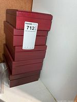 Stack of five red wooden trinket boxes