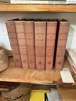 Front spines of all six volumes showing titles and maple leaf motifs