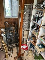 Full view of wood coat rack in storage area
