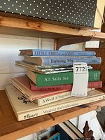 Stack of vintage children’s books showing titles Little Chief of the Gaspe, Explaining Why, All Sails Set, On a River Trip, A World of Surprises, Disney’s Wonderful World of Knowledge