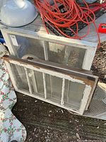 Two windows, one single-pane and one multi-pane, showing overall wear