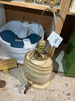 Full view of stoneware port keg lamp with wiring and harp