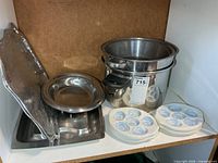 Group shot showing pot with insert, trays, escargot dishes