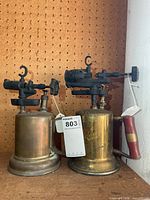 Both brass blow torches side by side