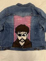 Back view showing full hand-painted graphic and jacket details
